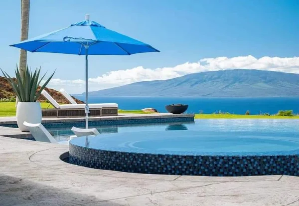 Before and after photo of a Maui pool surface restored through pool rebuffing Before and after photo of a Maui pool surface restored through pool rebuffing